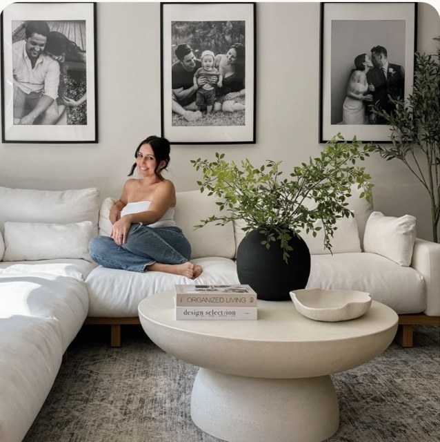 Sarah seated in her living room